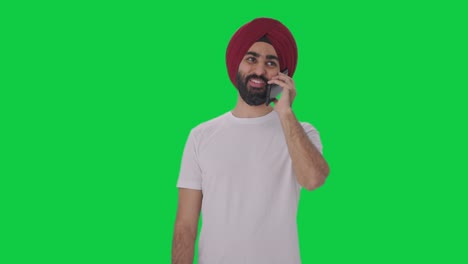 Happy-Sikh-Indian-man-talking-on-phone-Green-screen