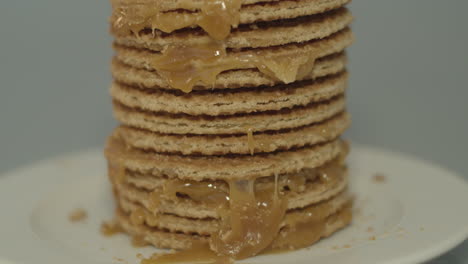 tilt down of delicious stack of stroopwafels, a typical dutch cookie