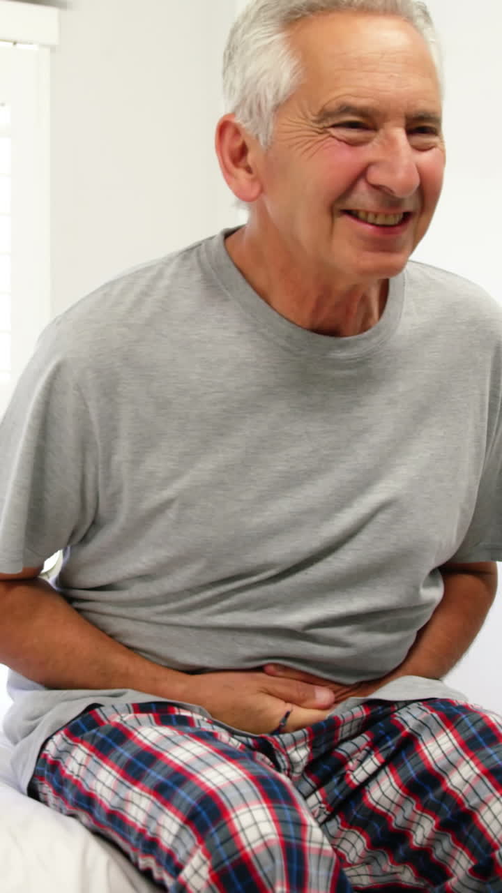Mature man having stomach pain