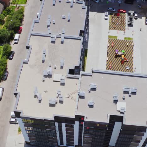 new high-rise housing apartments. modern residential complex with playground and parking places in the city. top aerial view