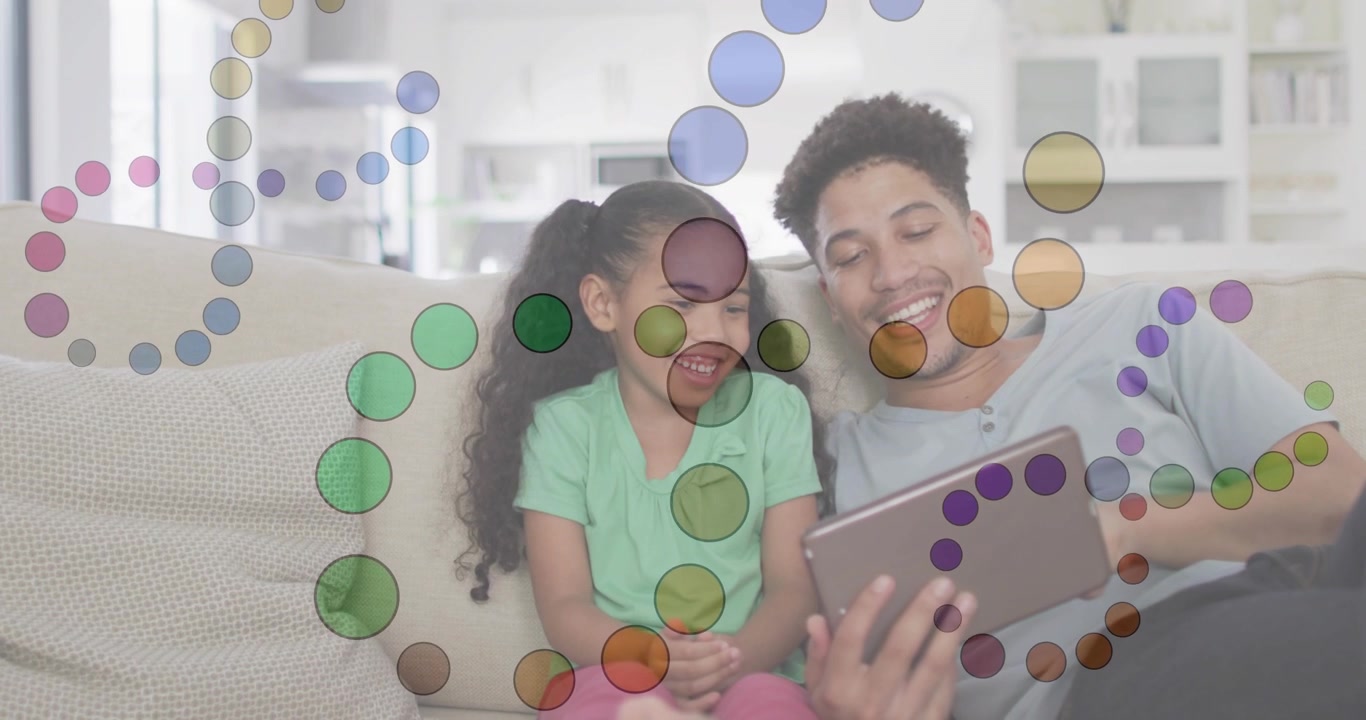 Vertical video: Father and child watching tablet on sofa, moving dots leading father tilting tablet