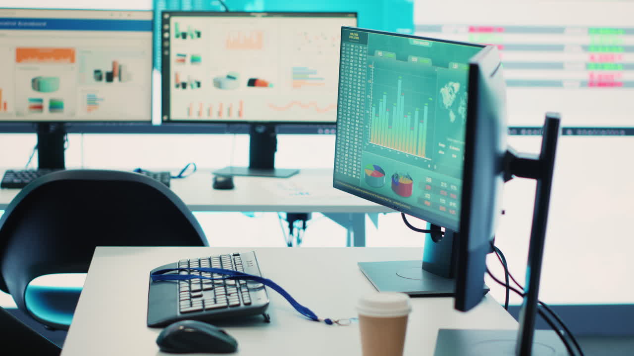 Empty telecommunications control room with workstations