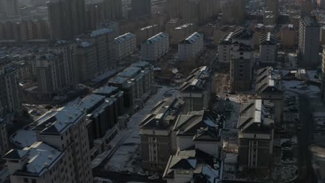 aerial tilting up shot to reveal rows and rows of identical eastern bloc housing in communist state. 4k