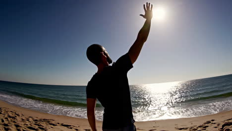 man enjoying the beach at sunrise/sunset
