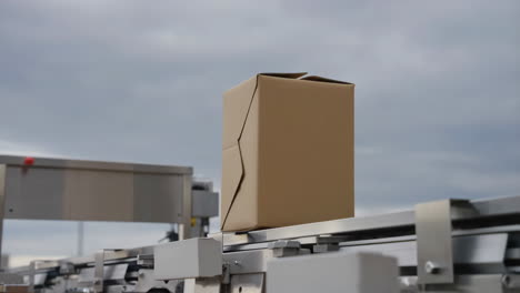 cardboard box on a conveyor belt