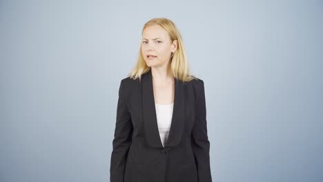 Business-woman-alerting-camera-with-stern-expression.