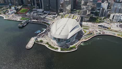 aerial of the hong kong convention and exhibition centre and city skyline, wan chai, hong kong, china