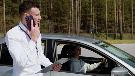 driving school teacher with student