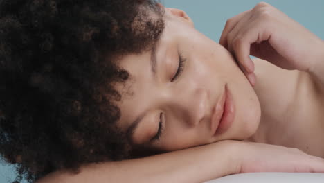 close up portrait beautiful mixed race woman touching face with hand caressing smooth healthy skin complexion enjoying perfect natural skincare gorgeous feminine beauty concept