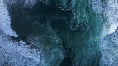 waves washing onto northern california beach near san francisco - straight down shot
