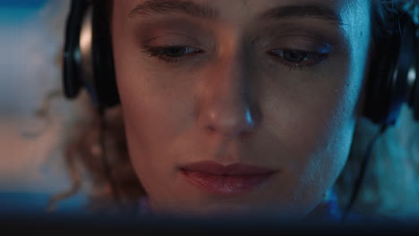 close up portrait beautiful woman using tablet computer browsing online enjoying listening to music wearing headphones