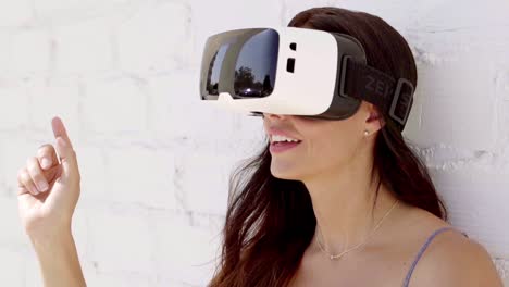 Young-woman-wearing-virtual-reality-goggles