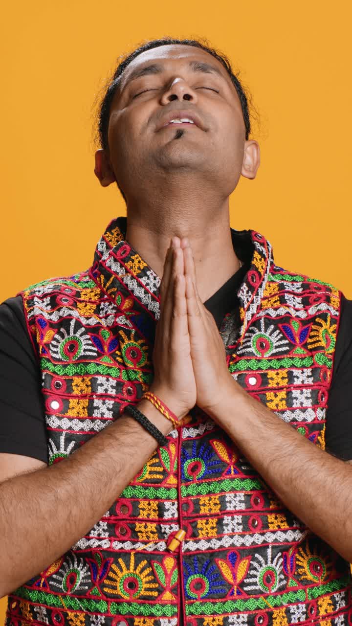 Indian Man Praying with Namaste Gesture in Traditional Attire