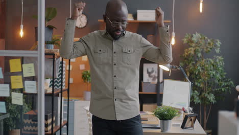 happy man dancing in office