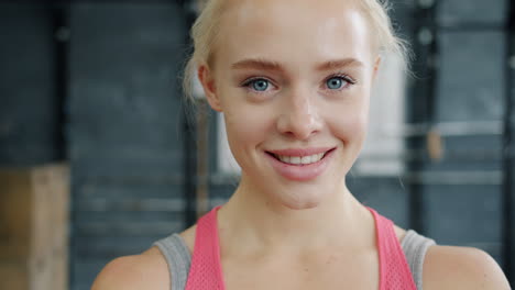 portrait of a happy woman in a gym