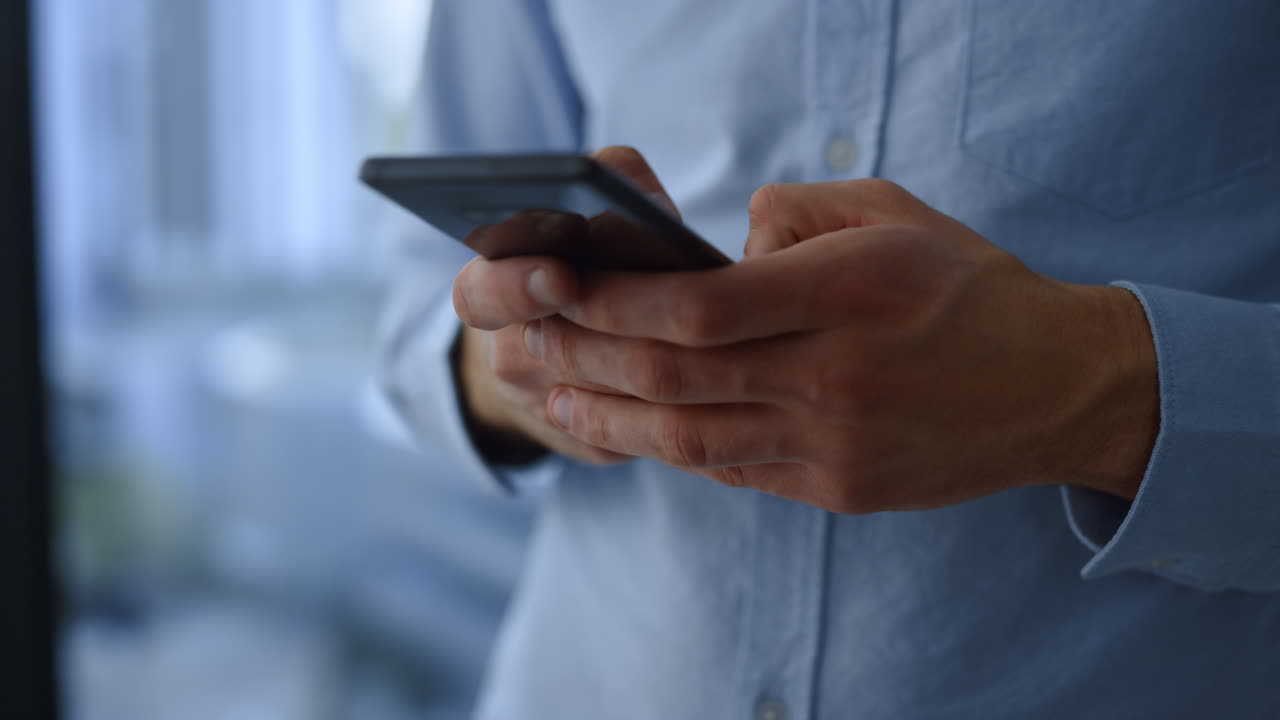 Closeup young man using phone