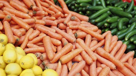 carrots, lemons and cucumbers at a market