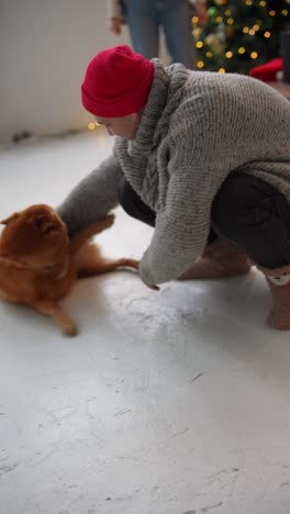 happy family celebrating christmas with a dog