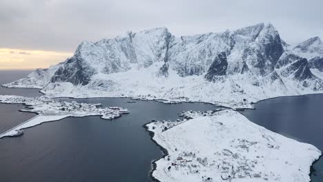 drone footage of reine, norway during a cold winters day