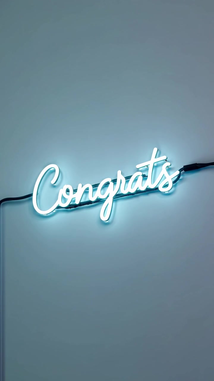 Glowing 'Congrats' Neon Sign with Changing Colors