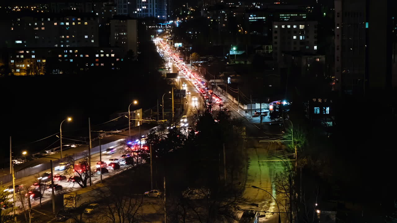 Aerial drone view of cars moving in traffic in Chisinau, Moldova in the evening time lapse