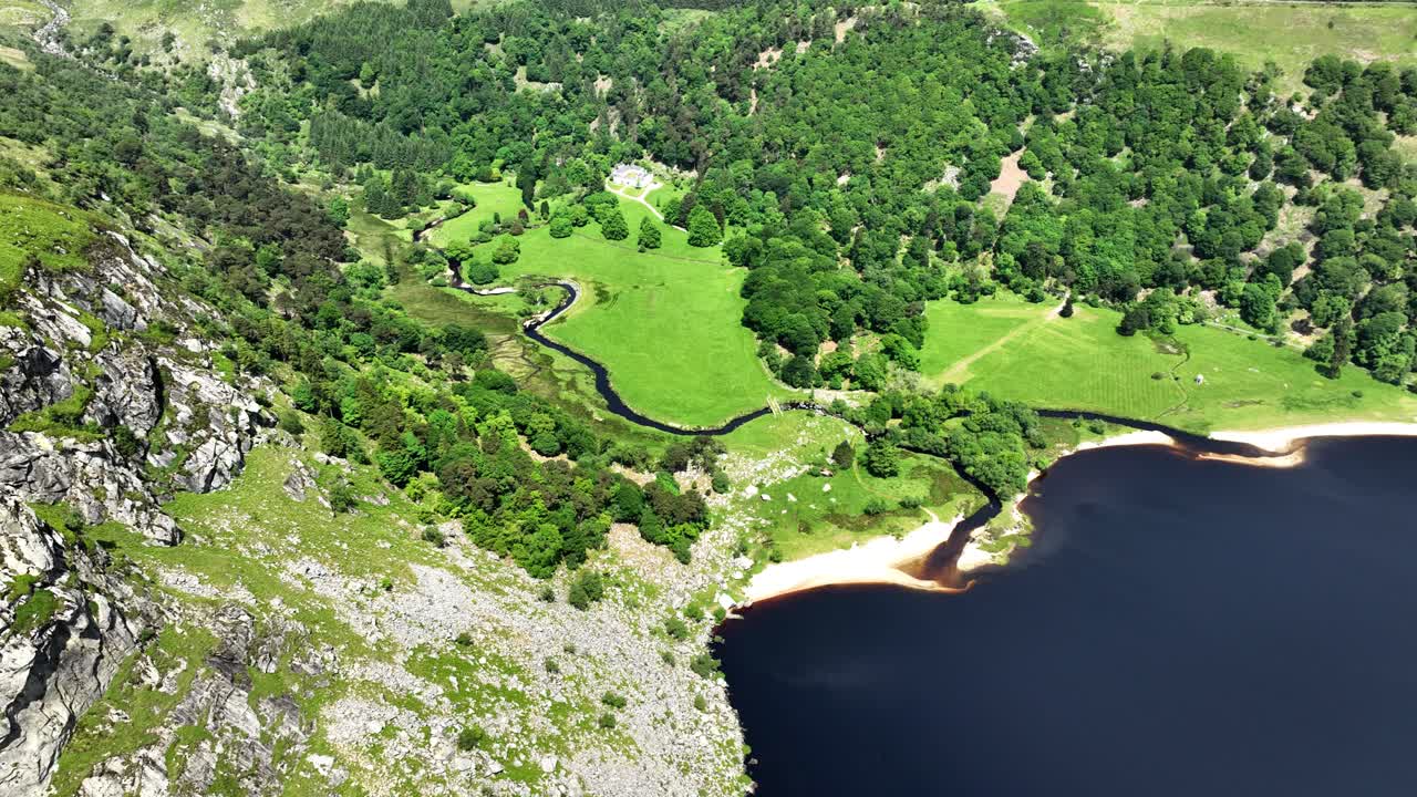 Ireland Epic locations Lough Tay in The Wicklow mountains popular attraction for tourists on a summer afternoon
