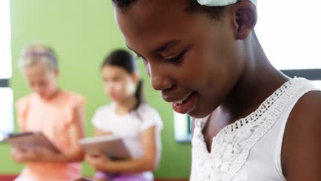 Schoolgirl-using-digital-tablet