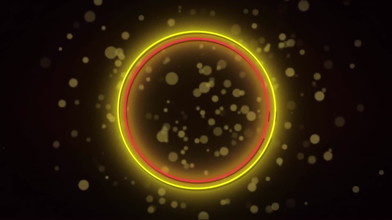 animación de anillos de neón rojos y amarillos sobre manchas de luz sobre fondo negro.