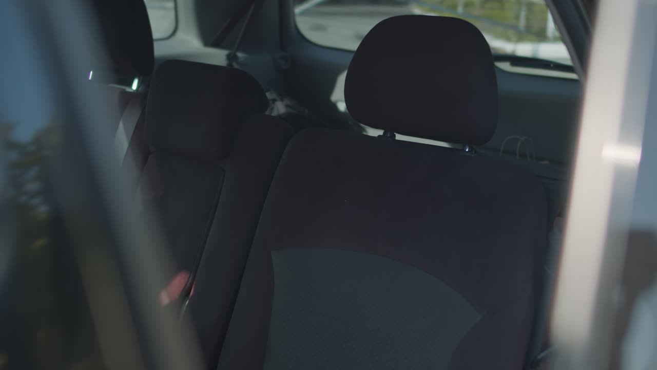 Schoolboy Getting into Car after School