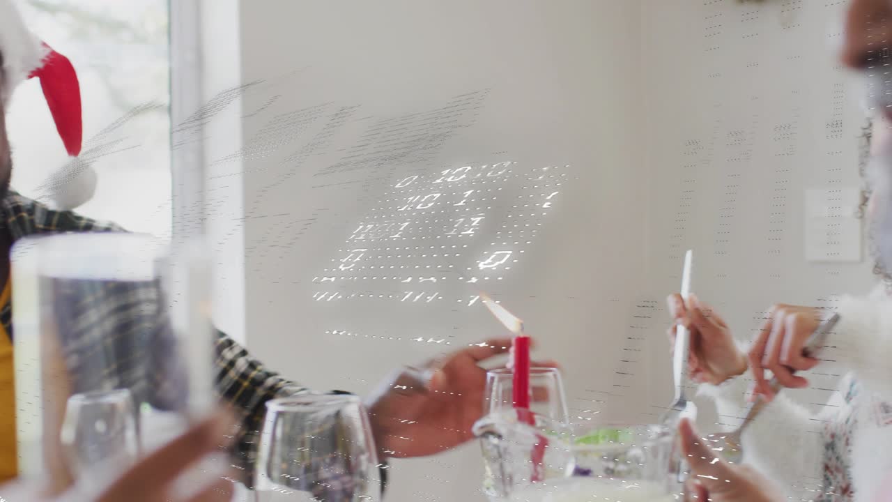 Man in Santa hat lifting bottle, pouring drink at holiday meal while tech overlay obscuring hands
