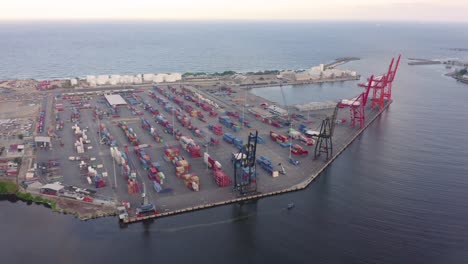 a drone circle orbits around port haina early in the morning before opening hours as the cranes are still aerial