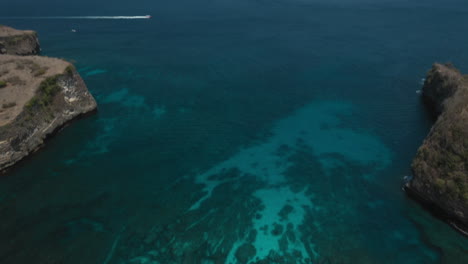 aerial view of ocean coastline waves breaking on shore beautiful blue sea drone flight over shoreline coastal surf 4k