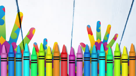 animación de lápices de colores sobre manos formadas con rompecabezas