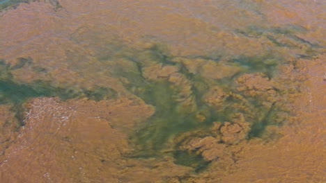 muddy water contaminating clean bule aqua river mekong at the start of south east asia monsoon season