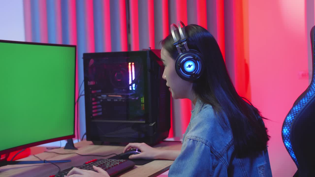 Young Asian Girl Gamer Win With Green Screen Monitor