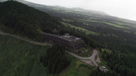 aerial approach to monte palace hotel nestled in azorean woods