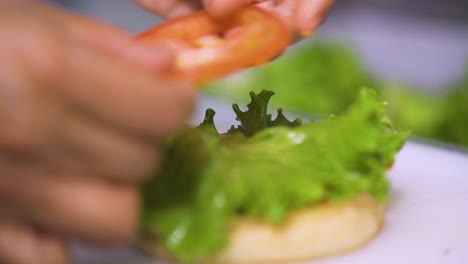 chef preparing a delicious hamburger