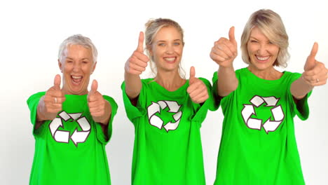 three enviromental activists giving thumbs up