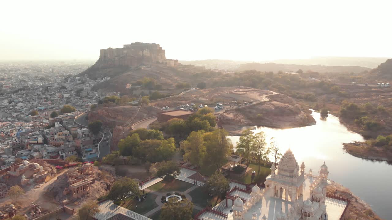 Aerial drone footage traveling along a hill top ridge above the vast city of Jodhpur, India