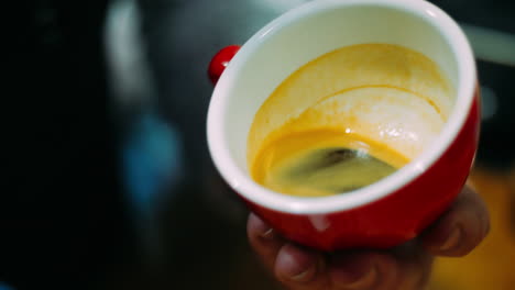 Man-holding-cup-with-aromatic-coffee-and-adding-milk.-Barista-cooking-latte