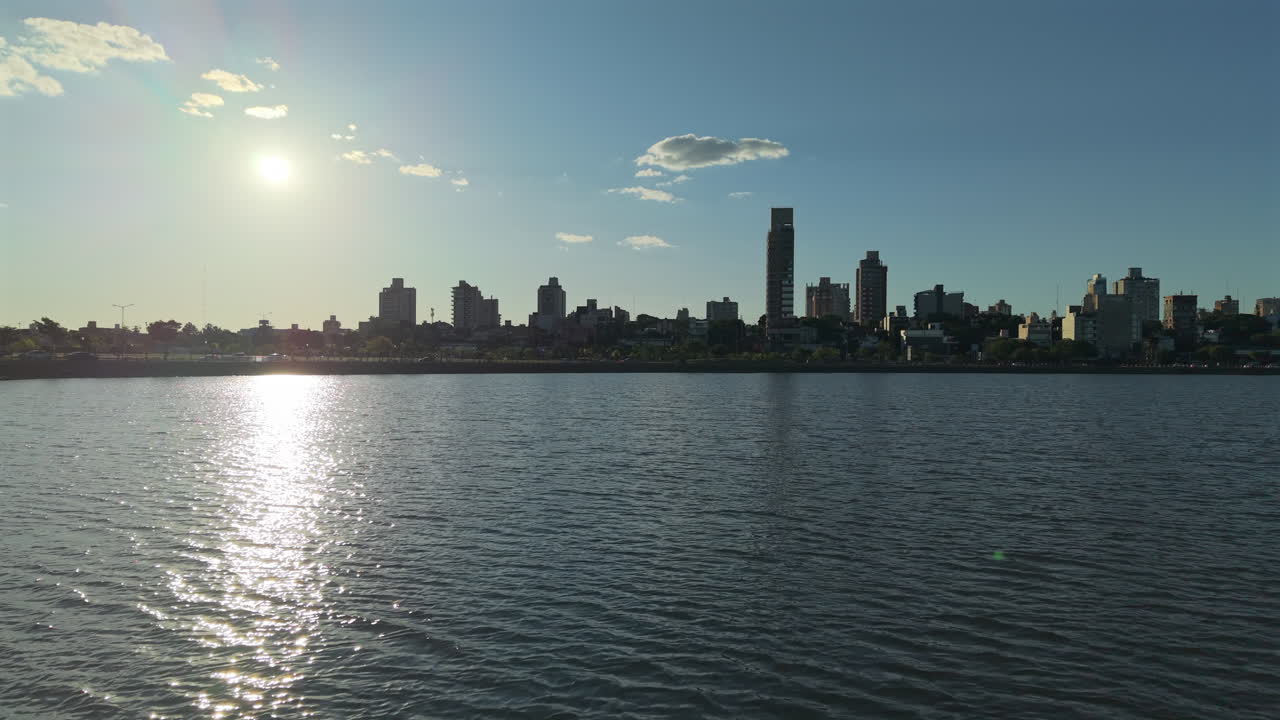 Drone FPV Fly close to water downtown beach at Paraná River, misiones Argentina downtown background, Posadas city