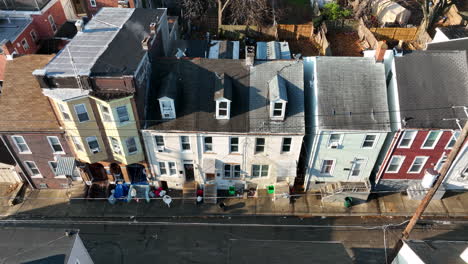 Trash-on-sidewalk-by-urban-American-homes