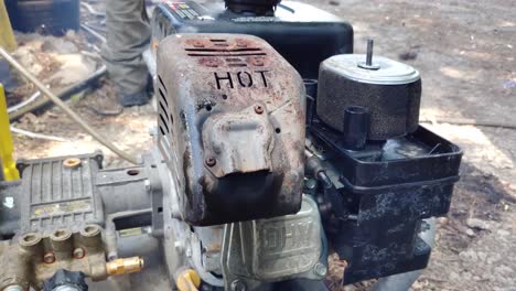 cranking a small engine pressure washer that is running poorly and smoking.