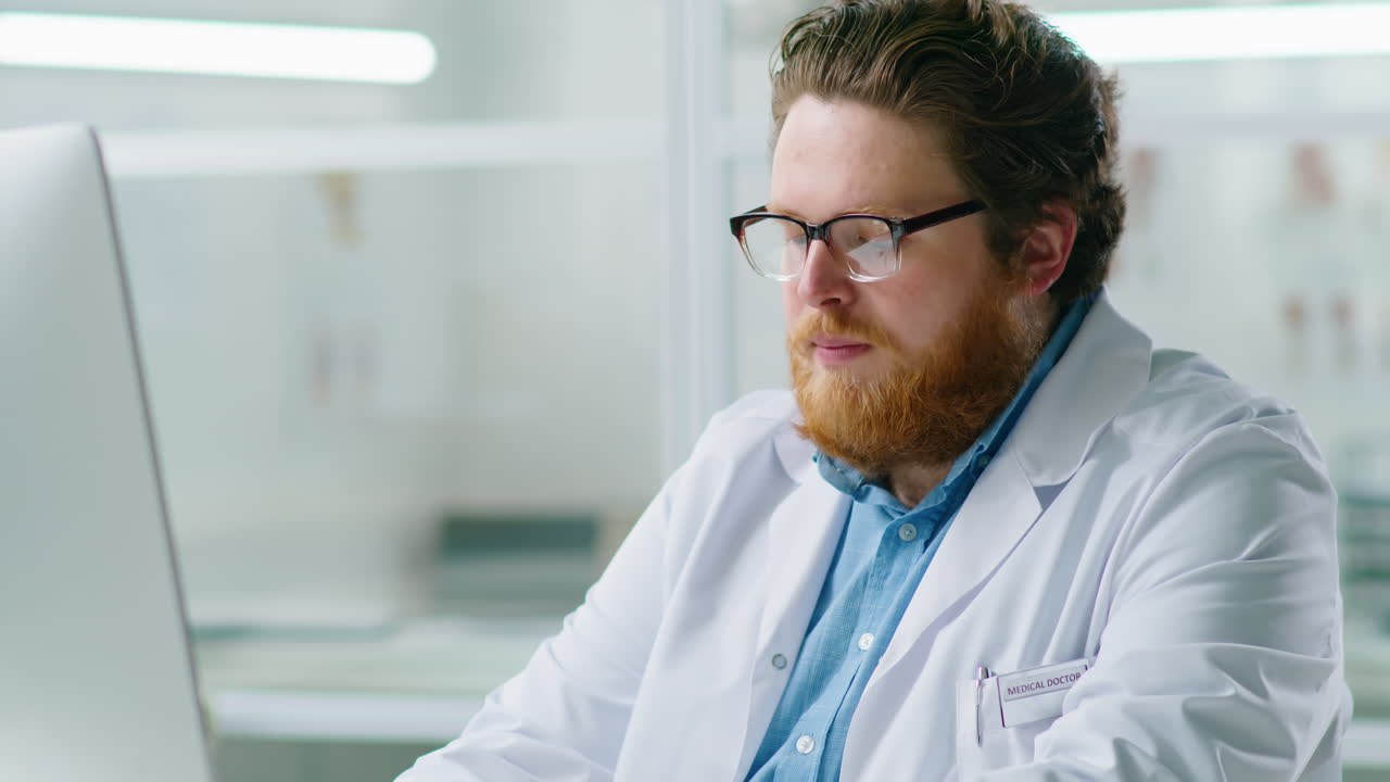 Doctor Working on Computer in Medical Office