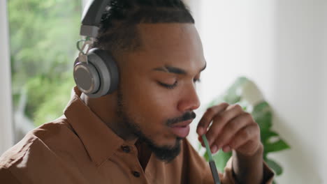 headphones student greeting video call at home closeup. freelancer talking