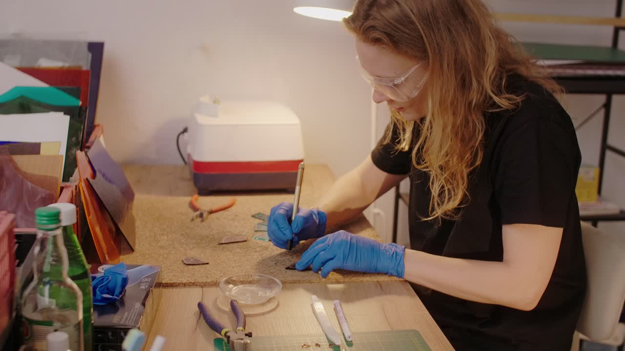 Woman Creating Stained Glass Art in Workshop