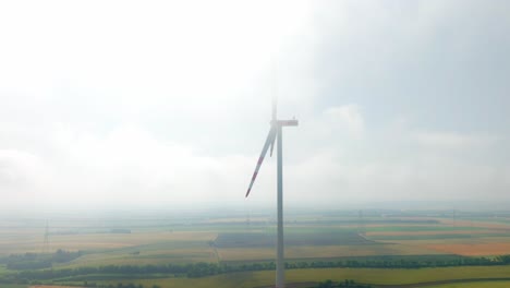 Windmill-Covered-In-Fog-In-Weinviertel,-Austria---Aerial-Shot