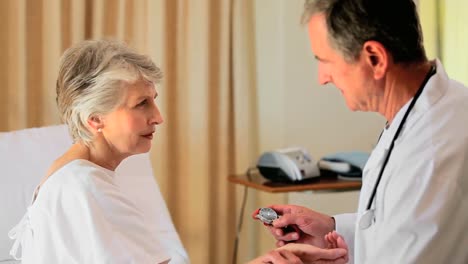 mature doctor visiting an elderly woman