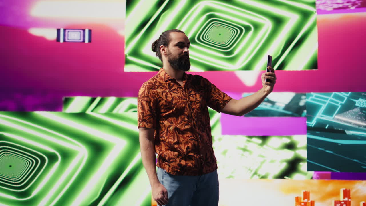 Young male performer feeling carefree with selfies and videos of himself