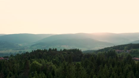 aerial shot revealing french vally and landscape in loire departement in auvergne rhone alpes region at sunset, france